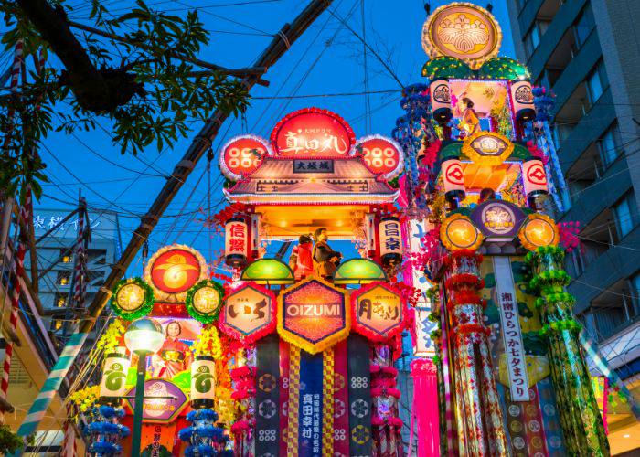 Shonan Hiratsuka Tanabata Festival, with grand, glowing decorations lighting up the evening sky. 